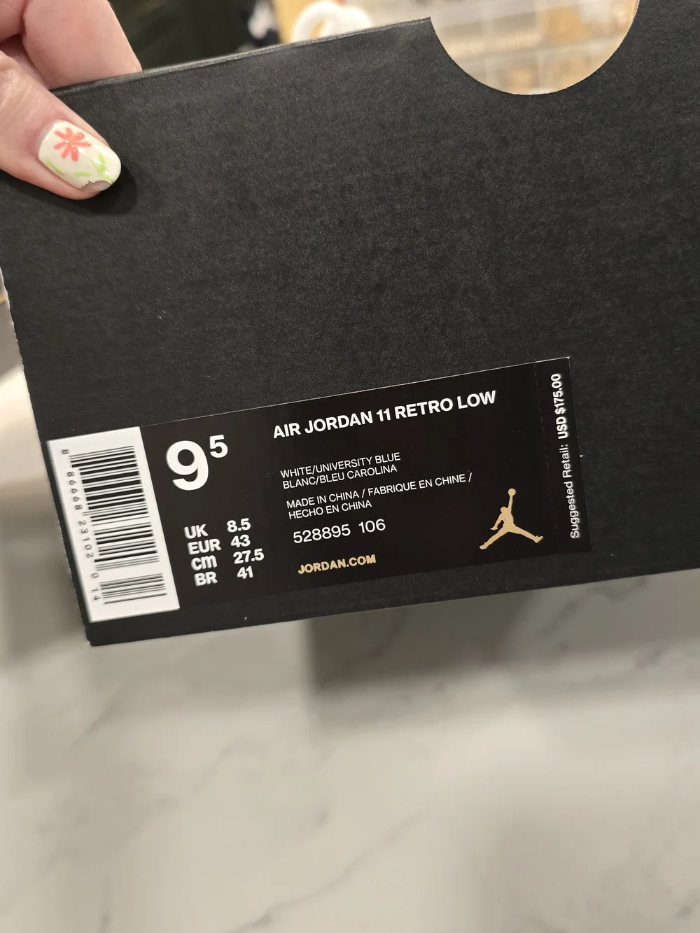 Air Jordan 11 Low Retro White and University Blue Sneakers